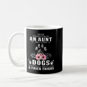 never underestimate an aunt who loves dogs has tat coffee mug