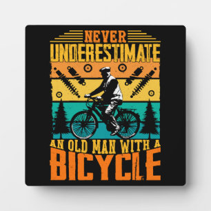 Never Underestimate An Old Man On A Bike Plaque