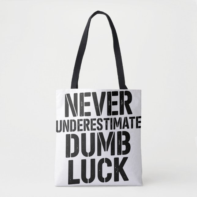 "Never Underestimate Dumb Luck" Saying Tote Bag (Front)