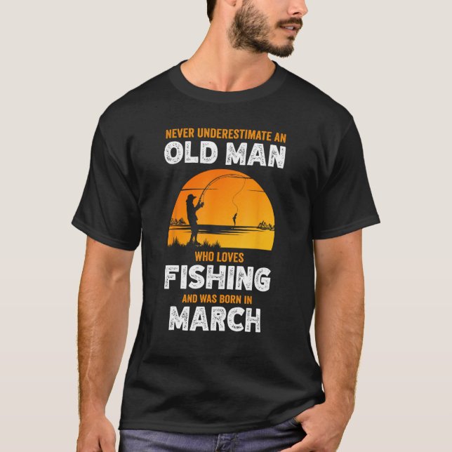 Never Underestimate Old Man Loves Fishing Born in  T-Shirt (Front)