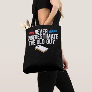 Never Underestimate The Old Guy Cornhole Tote Bag