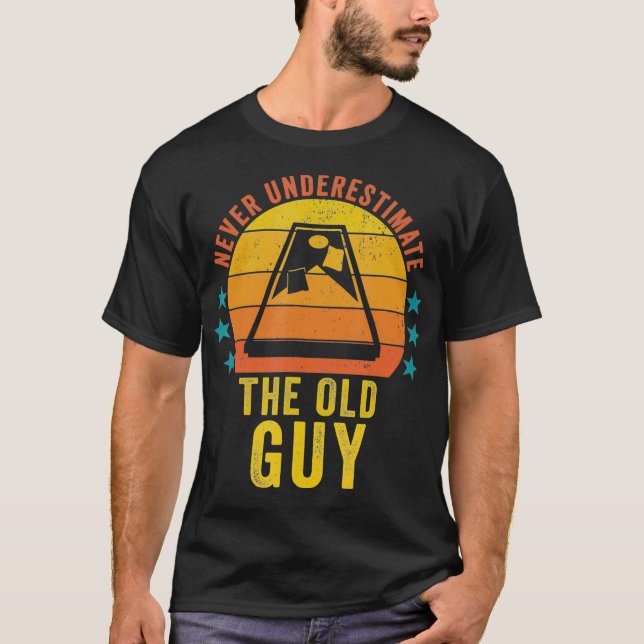 Never Underestimate The Old Guy Funny Cornhole Gam T-Shirt (Front)