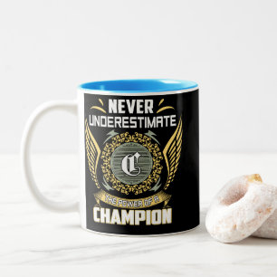 Never Underestimate The Power Of A Champion Two-Tone Coffee Mug