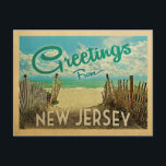 New Jersey Shore Beach Vintage Travel Postcard<br><div class="desc">This Greetings From New Jersey vintage postcard design features a sandy beach with a beautiful turquoise ocean water and above the sea,  a blue sky with billowy white clouds. In vintage travels style.</div>
