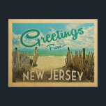 New Jersey Shore Beach Vintage Travel Postcard<br><div class="desc">This Greetings From New Jersey vintage postcard design features a sandy beach with a beautiful turquoise ocean water and above the sea,  a blue sky with billowy white clouds. In vintage travels style.</div>