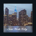 NEW YORK SKYLINE IN BLUE MAGNET<br><div class="desc">Colorful Refrigerator Magnet Featuring The Empire State Building Lit  Up In Blue And The New York City Skyline At Dusk</div>