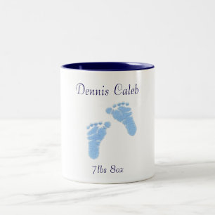 Newborn baby boy feet coffee cup