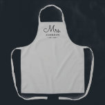 Newlywed Bride Personalised Grey Apron<br><div class="desc">For the bride and groom, this grey apron features "Mrs." in a modern script font along with a last name and established date. This is a perfect bridal shower or wedding gift. These Mrs. and Mr. aprons are available in a variety of colours and can be also customised to match...</div>