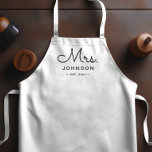 Newlywed Bride Personalised White Apron<br><div class="desc">For the bride and groom, this white apron features "Mrs." in a modern script font along with a last name and established date. This is a perfect bridal shower or wedding gift. These Mrs. and Mr. aprons are available in a variety of colours and can be also customised to match...</div>