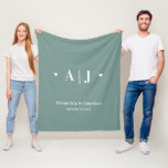 Newlywed Monogram Sage Green Fleece Blanket<br><div class="desc">This fleece blanket offers a modern minimal design featuring a monogram and the newlyweds name and wedding date. The background is a light sage green and can be changed to any other dark colour. This is a great personalised gift for the newlyweds.</div>