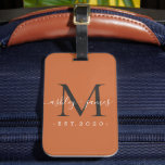 Newlywed Mr Mrs Black Monogram Names Burnt Orange Luggage Tag<br><div class="desc">Chic, modern and simple monogrammed luggage tag with the text Mr and Mrs in white elegant handwritten script calligraphy on a burnt orange background with your monogram in jet black. Simply add your married name, year established and monogram in stylish typography. Perfect luxury gift for the newlywed couple's wedding guests....</div>
