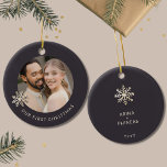 Newlywed's First Christmas Photo Ornament<br><div class="desc">Celebrate a special milestone with this Newlywed's First Christmas ornament. Cherish your first holiday together as a married couple with this exquisite ornament featuring a customisable photo framed by a delicate champagne gold snowflake on a rich dark background. The front elegantly displays 'Our First Christmas' in the lower thirds, capturing...</div>