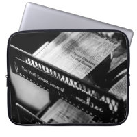 NEWSPAPERS ON THE WALL STREET JOURNAL RACK