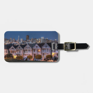 Night view of 'painted ladies' houses luggage tag