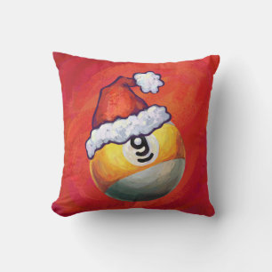 Nine Ball in Santa Hat on Red Cushion