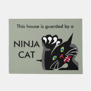Ninja cat on guard doormat