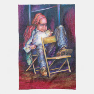 Norman prefers to draw in his Sleep Tea Towel