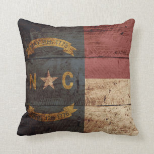 North Carolina State Flag on Old Wood Grain Cushion