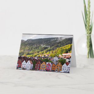 Norwegian town with mountains in the background card