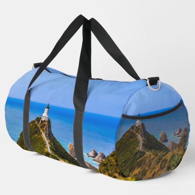 Nugget Point lighthouse, New Zealand Duffle Bag (Right Corner)