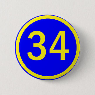 number 34 in a circle 6 cm round badge