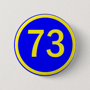 number, 73,  in a circle 6 cm round badge