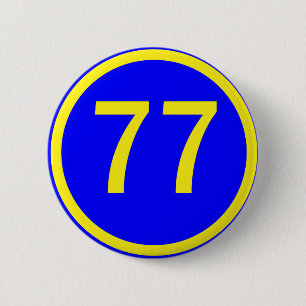 number, 77,  in a circle 6 cm round badge