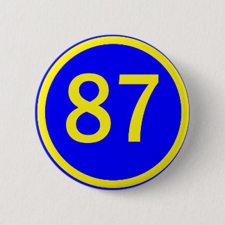 number, 87, in a circle 6 cm round badge