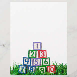 Number blocks stacked on grass
