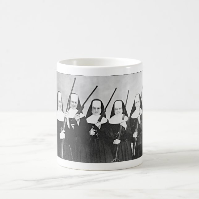 NUNS WITH GUNS COFFEE MUG. COFFEE MUG (Center)