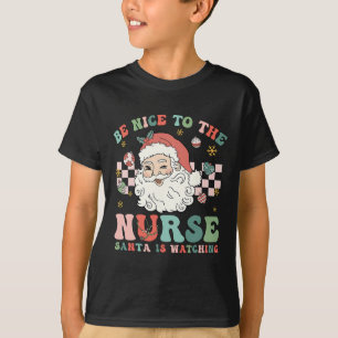 Nurse Christmas Be Nice To The Nurse Santa Is Watc T-Shirt