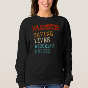 Nurses Saving Lives Becoming Heroes Medical Assist Sweatshirt