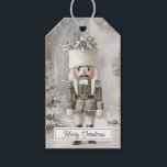 Nutcracker Toy Soldier Christmas Gift Tags<br><div class="desc">This illustrated Christmas gift tag features a vintage style nutcracker toy soldier standing tall in a snowy woodland. Dressed in festive parade attire with feathered hat and classic details, he brings timeless charm to your holiday wrapping. The front reads Merry Christmas in traditional script, and the back includes lines for...</div>