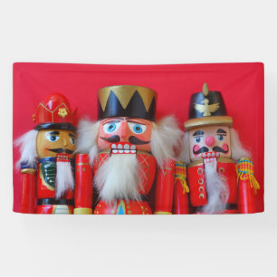 Nutcrackers in red uniforms banner