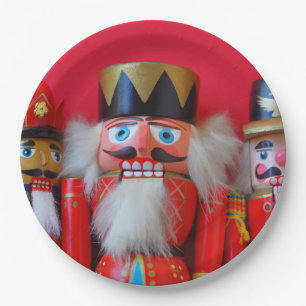 Nutcrackers in red uniforms paper plate