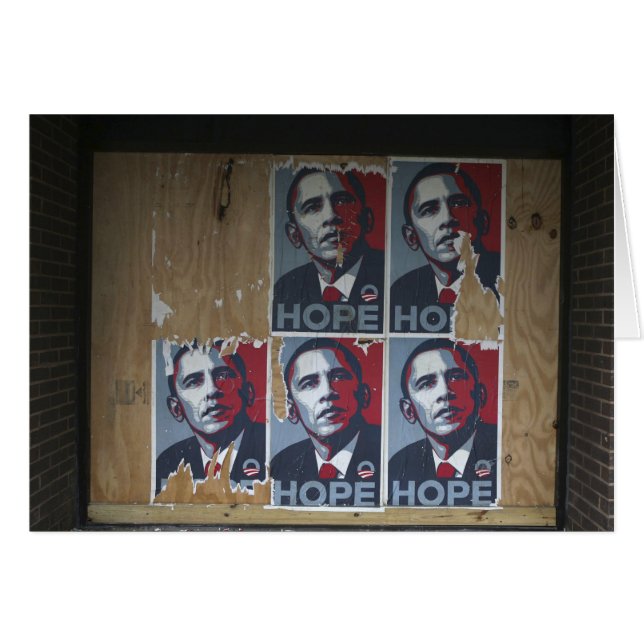 Obama signs in a boarded window of a closed (Front Horizontal)