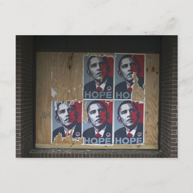 Obama signs in a boarded window of a closed postcard (Front)