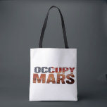 Occupy Mars Canvas Tote – Bold Statement for Futur<br><div class="desc">Make a fearless statement with this "Occupy Mars" canvas tote bag – a perfect blend of patriotism and vision. Designed for those who believe in a future beyond Earth, this bag symbolises innovation, curiosity, and ambition. The American flag-inspired text adds a bold and stylish flair. Ideal for everyday use, this...</div>
