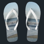 Ocean Waves Blue Sky Beach Sand Flip Flops<br><div class="desc">Pretty Blue Sky with Light Fluffy White Clouds, Blue Sea, Crashing Ocean Waves and Beach Sand Unisex Flip Flops. Shown with Wide White Straps and White Footbed. See options for flip flops in Slim Straps for more strap colours. Perfect for your summertime fun, trips to the beach, vacations, honeymoon or...</div>