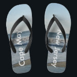 Ocean Waves Cape May New Jersey Flip Flops<br><div class="desc">Pretty Blue Sky with Light Fluffy White Clouds, Blue Sea, Crashing Ocean Waves and Beach Sand at Cape May, New Jersey fun Unisex Flip Flops. Shown with Wide Black Straps and Black Footbed. See options for flip flops in Slim Straps for more strap colours. Perfect for your summertime fun, trips...</div>