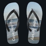 Ocean Waves Cape May Point New Jersey Flip Flops<br><div class="desc">Pretty Blue Sky with Light Fluffy White Clouds, Blue Sea, Crashing Ocean Waves and Beach Sand Unisex Flip Flops. Shown with Wide Black Straps and Black Footbed. See options for flip flops in Slim Straps for more strap colours. Perfect for your summertime fun, trips to the beach, vacations, honeymoon or...</div>