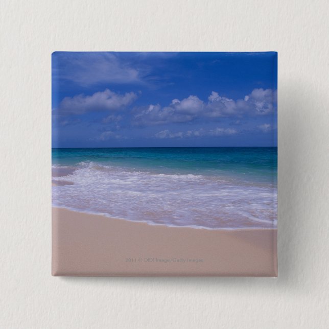 Ocean waves foaming onto sandy beach 15 cm square badge (Front)