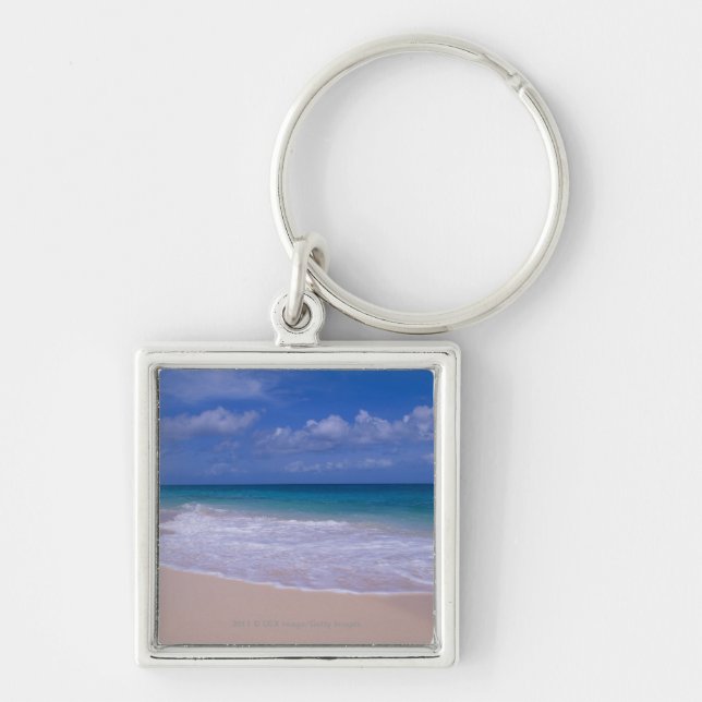 Ocean waves foaming onto sandy beach key ring (Front)