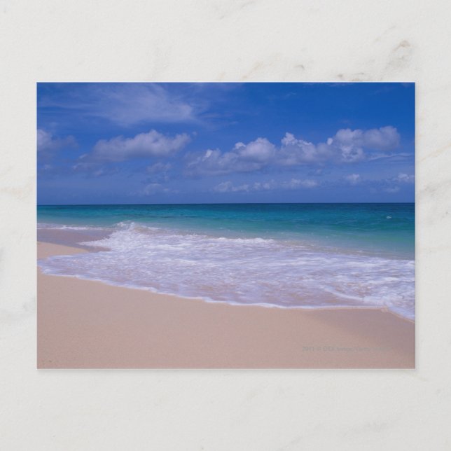 Ocean waves foaming onto sandy beach postcard (Front)