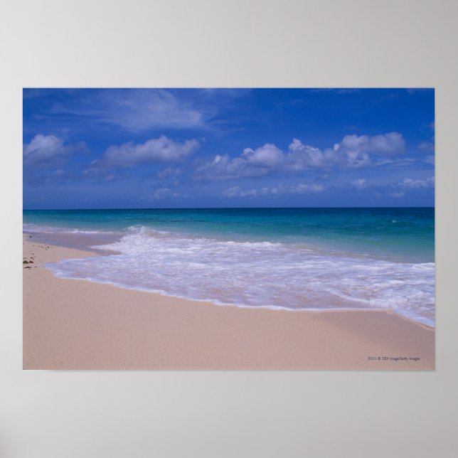 Ocean waves foaming onto sandy beach poster (Front)