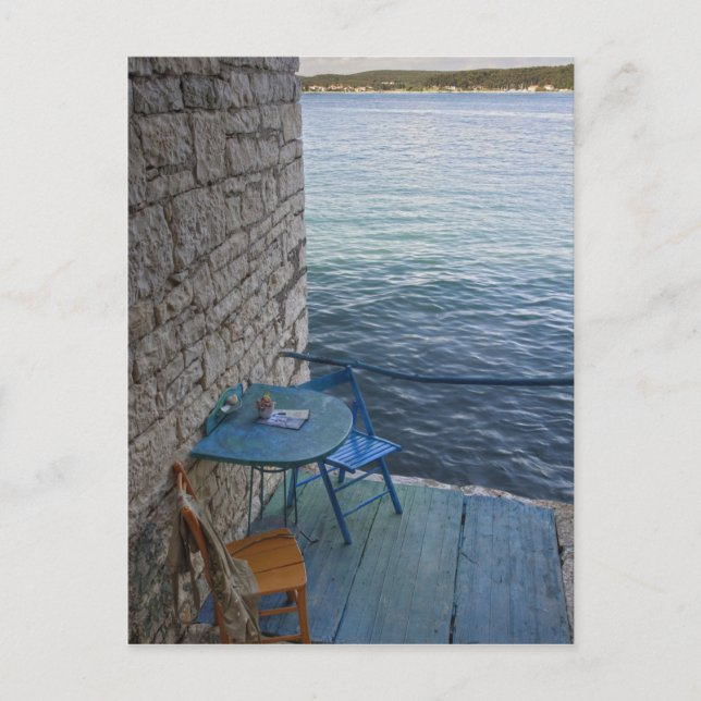 Oceanside seating for two at tiny outdoor cafe, postcard (Front)