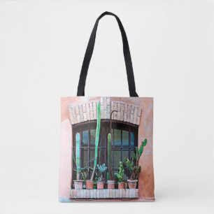 Old abandoned window with group of cactus flower p tote bag
