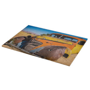 Old and abandoned car in Solitaire, Namibia Cutting Board