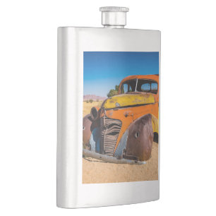 Old and abandoned car in Solitaire, Namibia Hip Flask