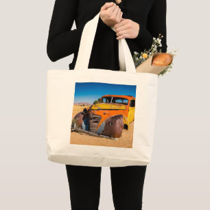 Old and abandoned car in Solitaire, Namibia Large Tote Bag